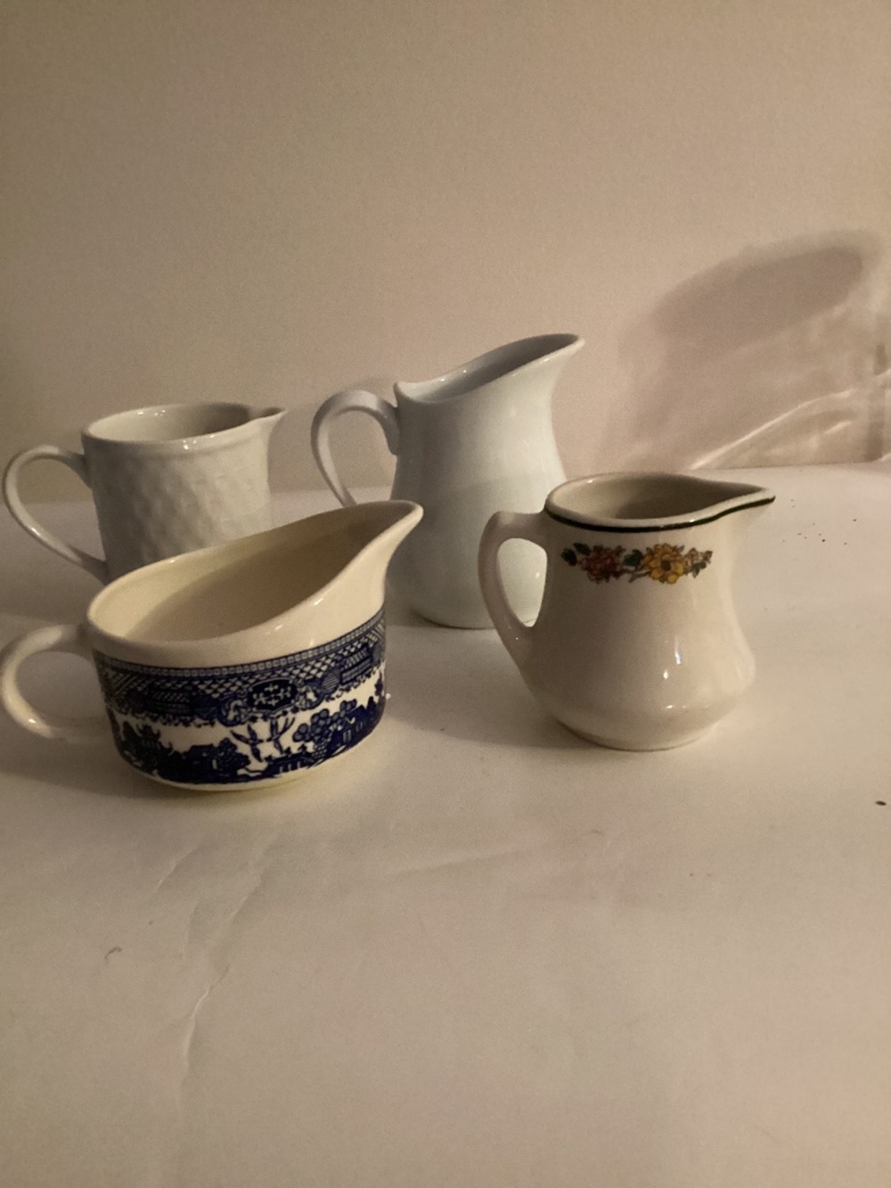 Lot of 4 Cream Pitchers 2 plain white, 1 restaurant wear , 1 Blue Willow